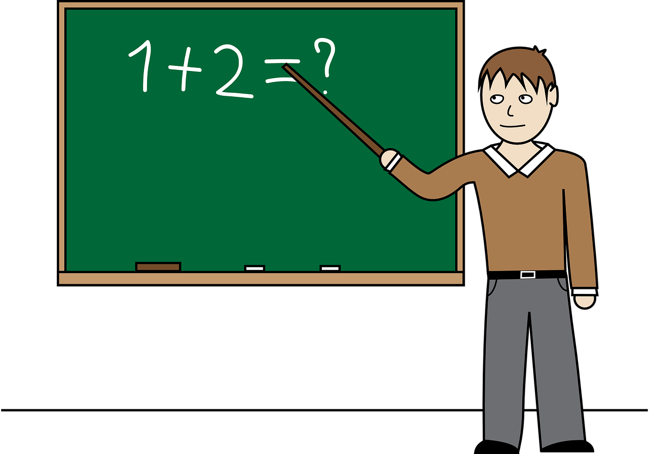 Grafika przedstawiająca nauczyciela stojącego przy tablicy